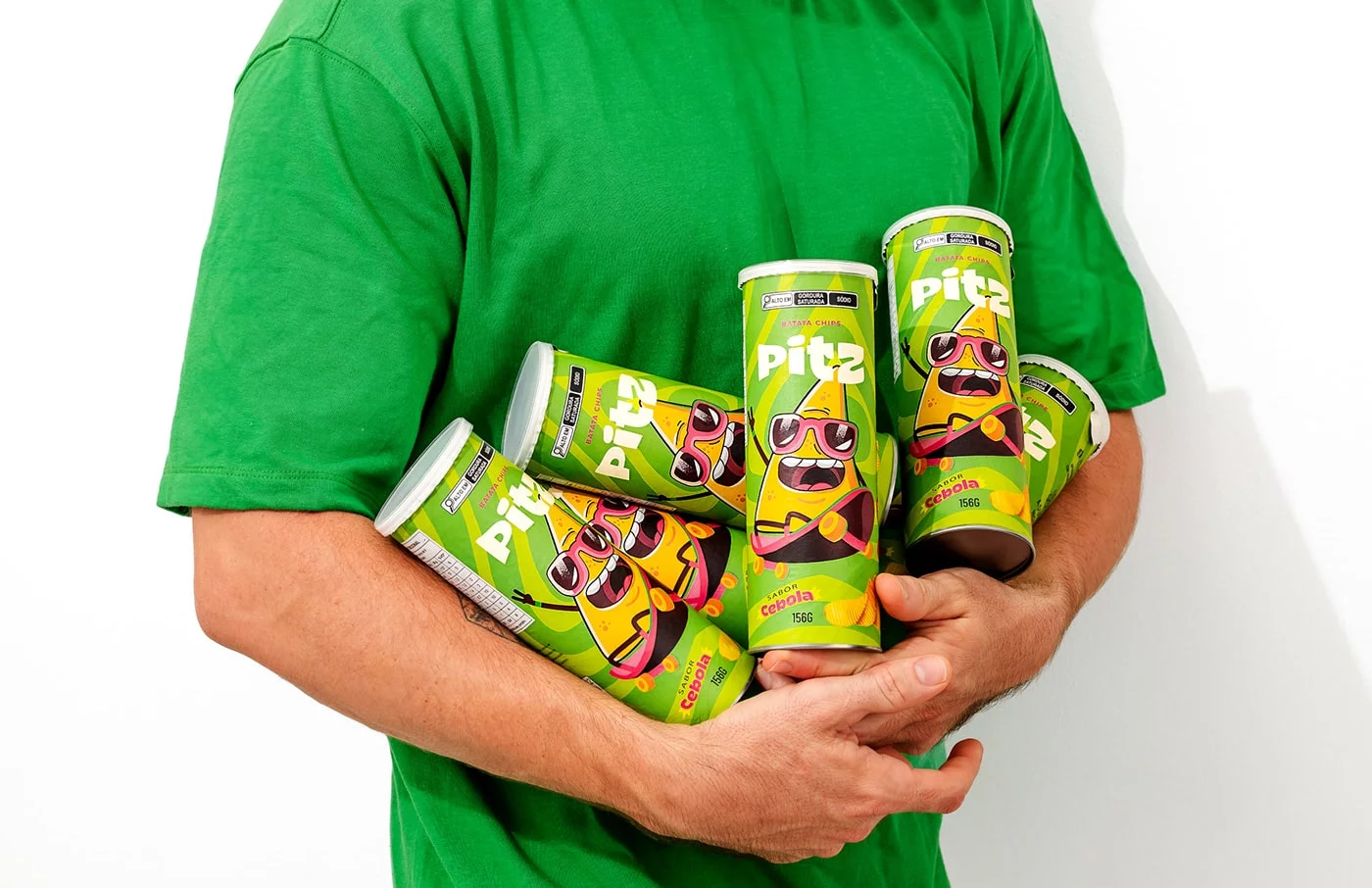 Vibrant Pitz snack packaging featuring a lively green and light color theme with engaging illustrations, capturing the essence of Brazilian energy and flavor.