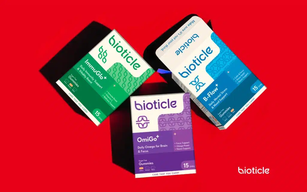 Bioticle supplements packaging hero, three gummy boxes ImmuGlo+, B Flow+, OmiGo+ on red backdrop, FMCG branding and packaging design by The Factor X.